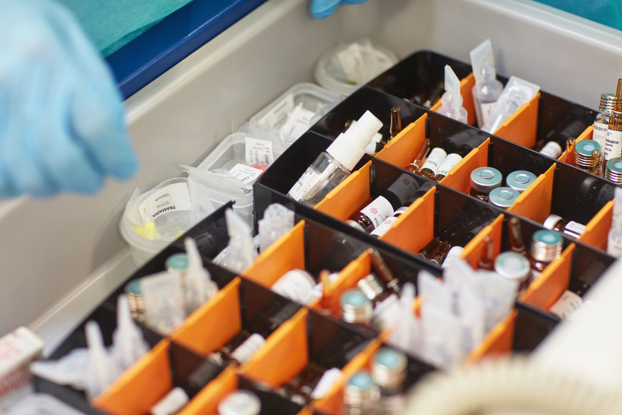 Gloved hands handling sterile medical supplies